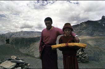 Young Monk Carrying Religious Texts